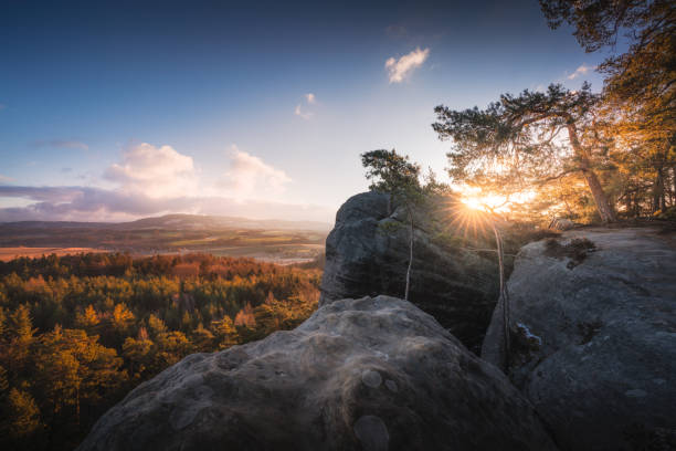 istock Huge rocks and dense trees at scenic sunset 1454332428