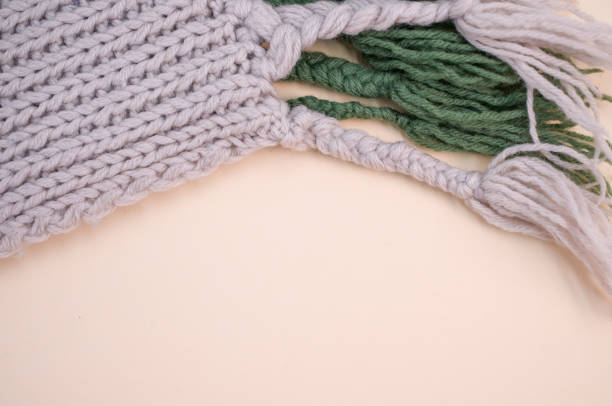 istock knitted soft natural wool on a beige background 1454332677