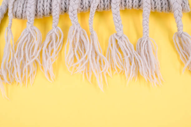 istock knitted soft natural wool scarf on a light yellow background 1454332732