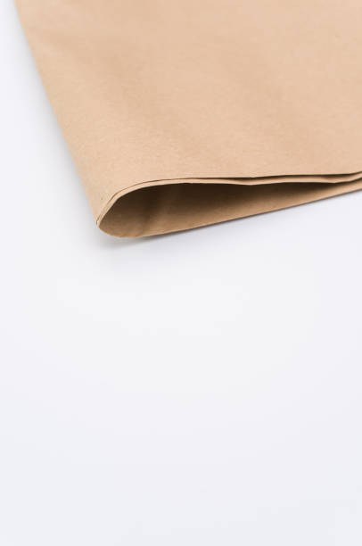 istock recycled brown Kraft paper folded on white background 1454333741