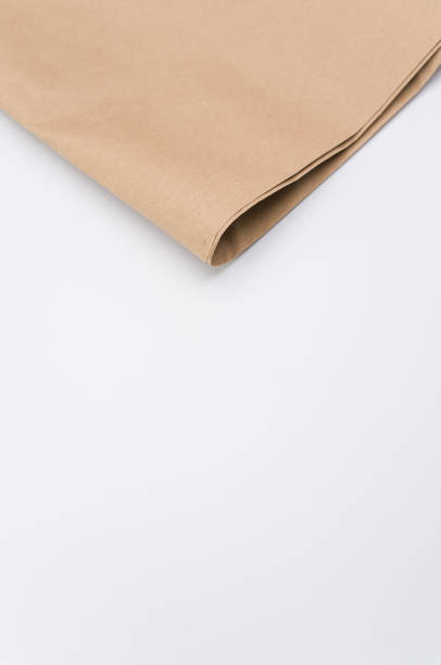 istock recycled brown Kraft paper folded on white background 1454333745