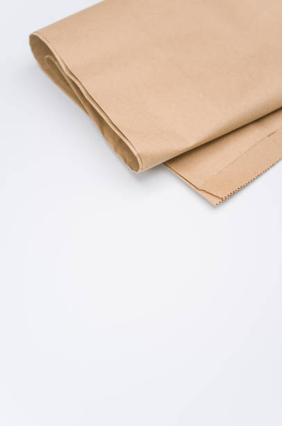 istock recycled brown Kraft paper folded on white background 1454333755