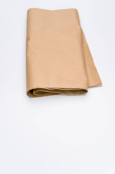 istock recycled brown Kraft paper folded on white background 1454333758
