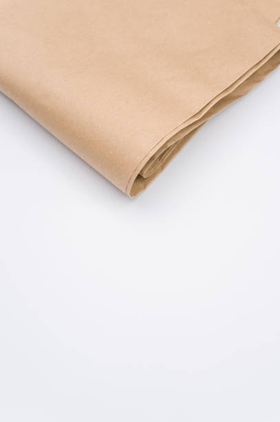 istock recycled brown Kraft paper folded on white background 1454333785