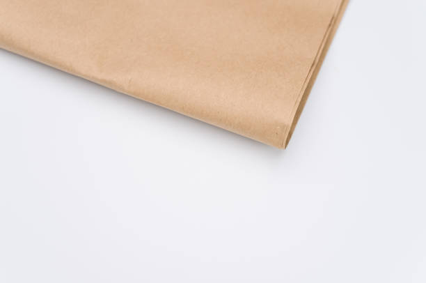 istock recycled brown Kraft paper folded on white background 1454333786