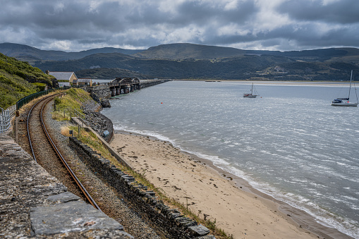 A railway on the coast of Barmouth in Wales, coastal landscape