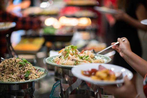 istock scooping the food, catering, dinner time 1454334329
