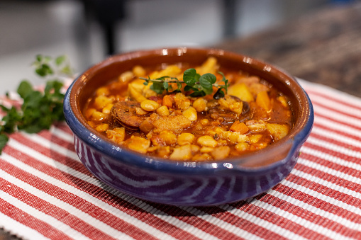 A closeup of a bowl of Cazuela. Cazuela de mondongo, winter food.