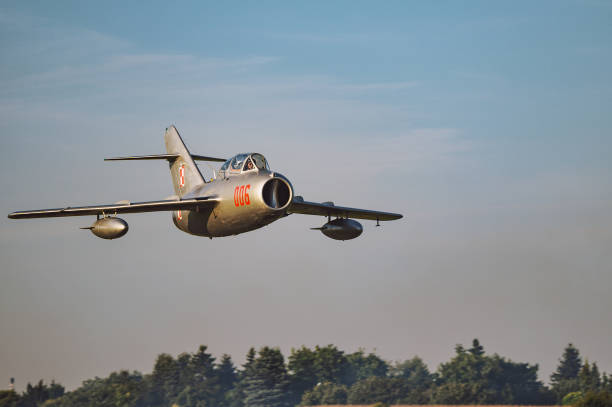 Low passing by of a Historical Spitfire in silhouette