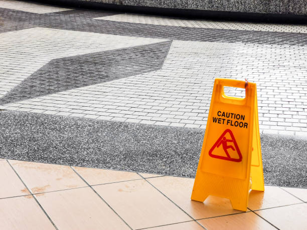 istock wet floor caution sign at the buiding enterance. 1454335283