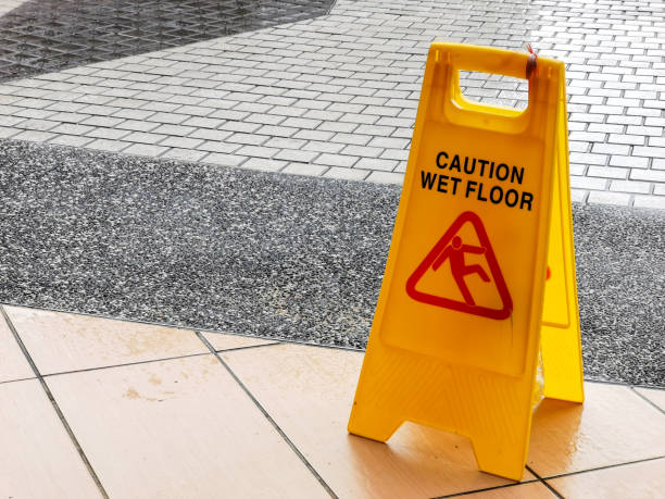 istock wet floor caution sign at the buiding enterance. 1454335410