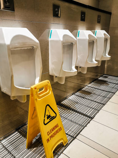 istock Selective focus image with noise effect cleaning in progress sign in public toilet. 1454335454