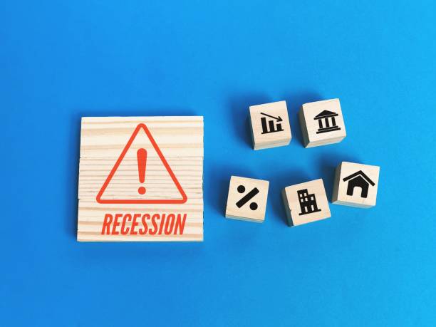 recession concept with icons on wooden blocks against blue background. - cheap finance cutting downsizing imagens e fotografias de stock