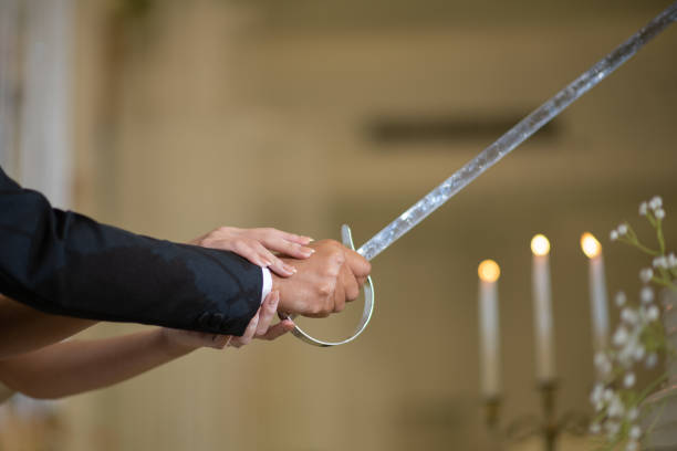 istock cutting cake wedding, couple hand together, celebration 1454335995