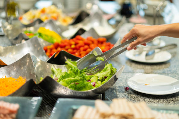 istock scooping the food, catering, dinner time 1454336133