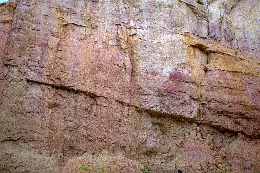 Fault lines and colorful layers in standstone also useful as a background or texture.