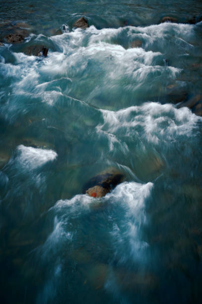 istock Vertical closeup shot of a stream waves 1454337825