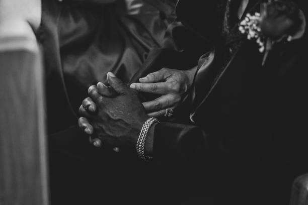 istock Greyscale closeup of an old couple holding hands 1454338174