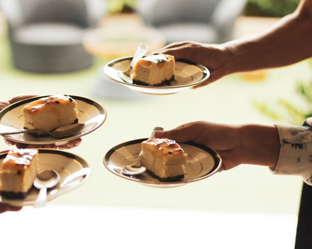 Four delicious cheesecakes glazed with honey on a white plates at a restaurant