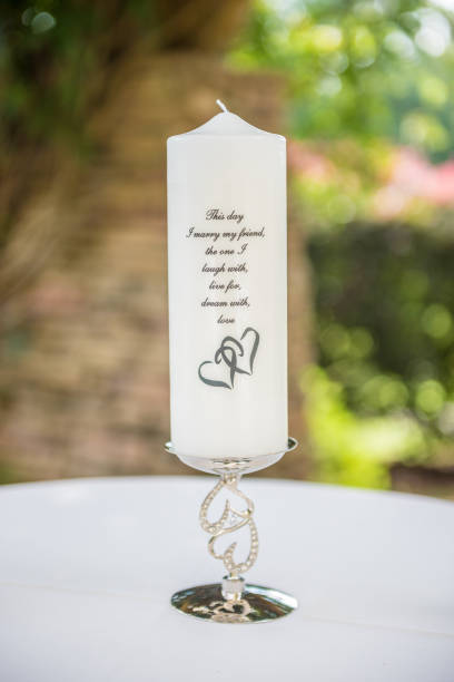 istock Closeup shot of a white, beautiful unity candle 1454341003