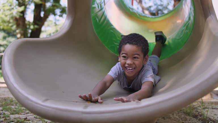 Child Playing slider in Playground