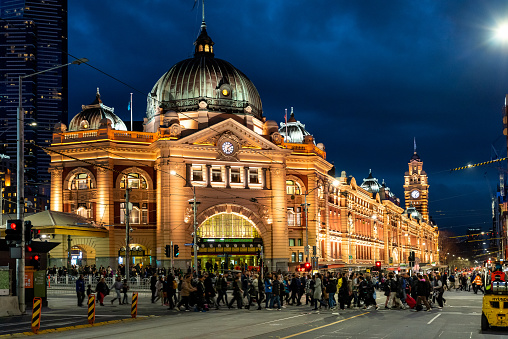 Melbourne, Australia – November 20, 2019: A shot of Flinders Street Station before the pandemic in Melbourne at night, Australia