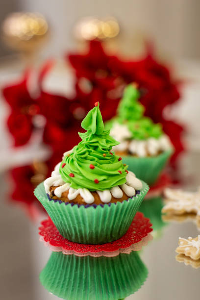 A vertical closeup of the Christmas cupcakes. Selected focus.