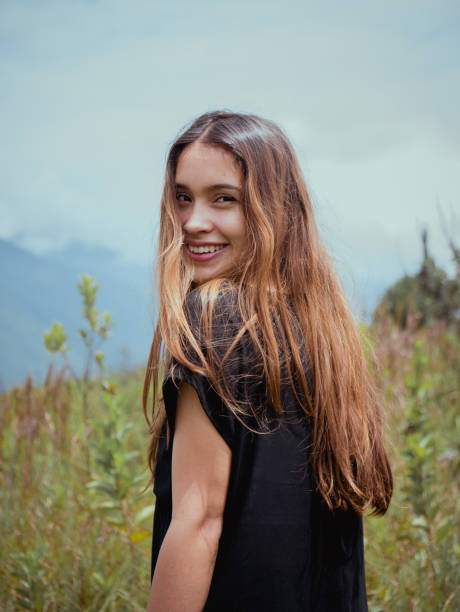 istock Happy young attractive girl in a field 1454343107