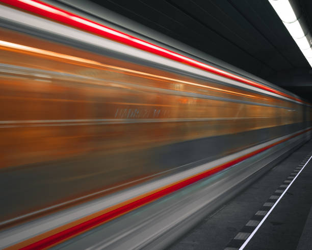 istock Scenic shot of a metro train illuminated in motion 1454343526