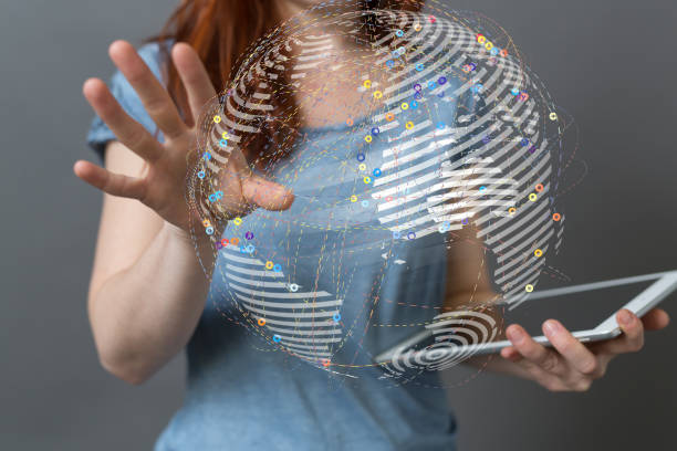 istock 3D rendering of global digital data hologram projecting from a businesswoman's tablet 1454345151