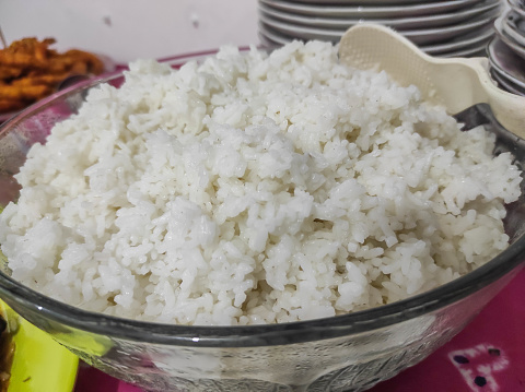Rice or Nasi in Indonesia - Cooked White Rice served in a bowl is main dish accompaniment to traditional Indonesian cuisine.