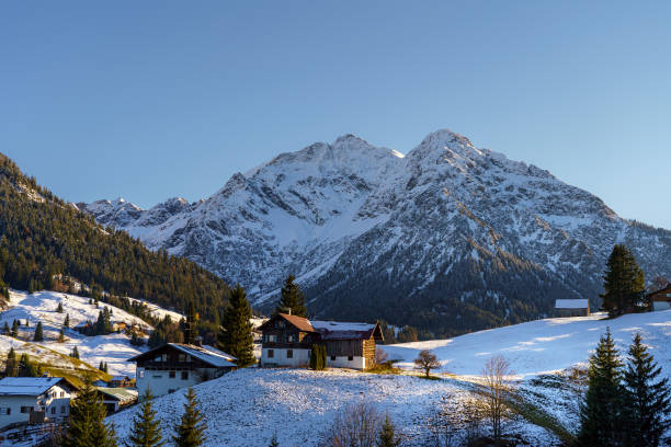 istock Scenic view of a snowy mountain on a clear sky background 1454346366