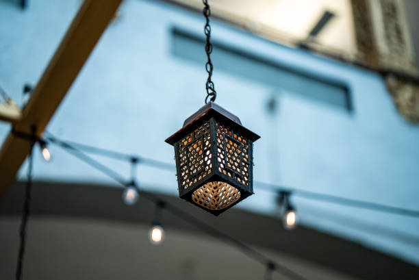 istock Decorative lantern hanging on a wooden ceiling outdoors 1454348466