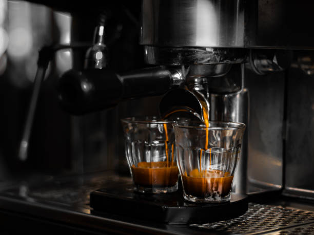 istock Coffee machine preparing two espressos in glasses 1454348808