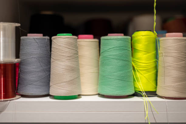 istock Many colors of thread on the shelves 1454350921