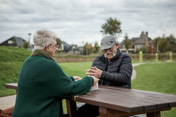 istock Stylish senior couple enjoying a picnic 1454352102