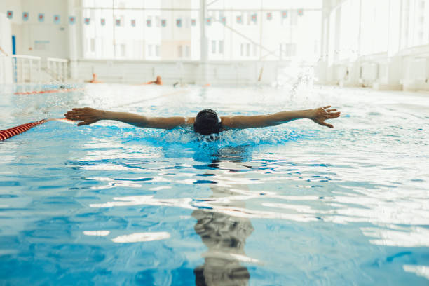 istock Fit woman swimming during training in pool 1454356568