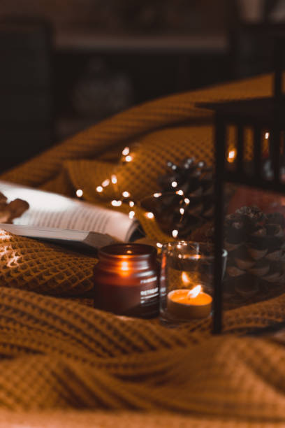 istock autumn photo on table with candles writing in a notebook 1454360794
