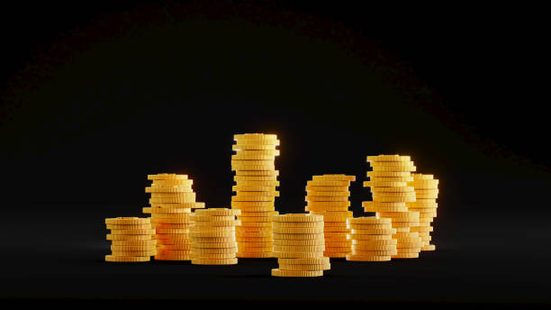 istock golden coins pile on dark background. Stack of golden coins 1454360985