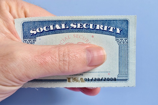Hand holding Social Security card