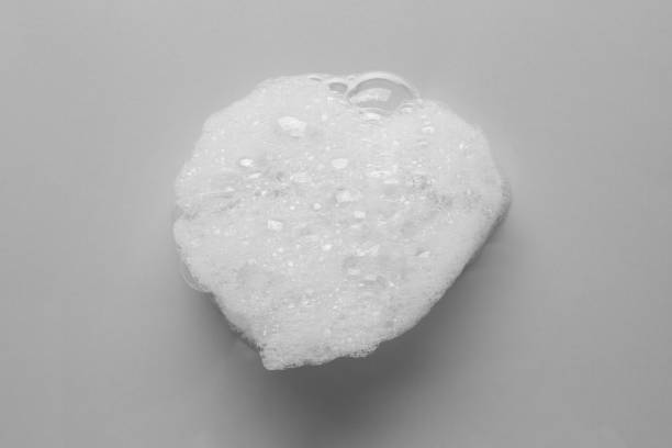 istock Drop of bath foam on light grey background, top view 1454361843