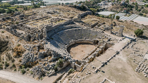 Aerial view of Xanthos ancient city, Roman ancient city, Turkey's most popular tourist destination, aerial view of theater from Xanthos Ancient City, Ruins in Ancient City, UNESCO ruins of ancient Greek city,aerial view of artifacts from the Lycian period Xanthos is a UNESCO World Heritage Site.

Xanthos was a centre of culture and commerce for the Lycians, and later for the Persians, Greeks and Romans who in turn conquered the city. As an important city in Lycia, it exerted significant architectural influences upon other cities of the region, with the Nereid Monument directly inspiring the Mausoleum at Halicarnassus in Caria.

Xanthos is the Greek appellation, acquired during its Hellenisation, of Arñna in the Lycian language. The Hittite and Luwian name of the city is given in inscriptions as Arinna (not to be confused with the Arinna near Hattusa). The Romans called the city Xanthus. ancient rome stock pictures, royalty-free photos & images
