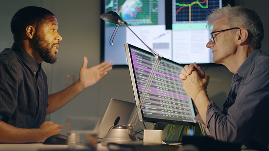 Businessman with statistic graph of stock market financial indices analysis on laptop screen, finance data and technology concept