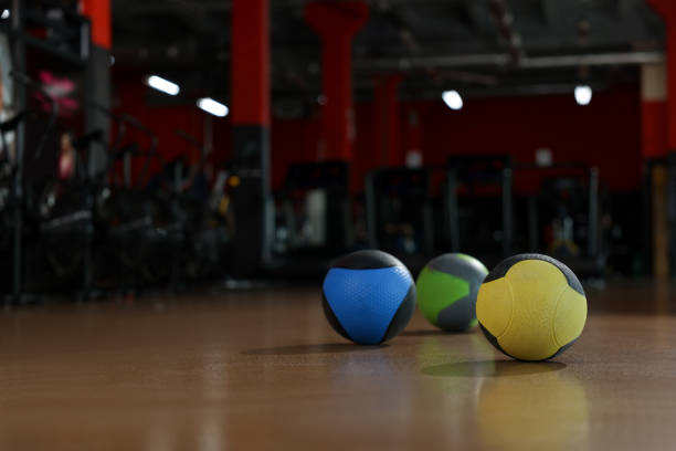istock Medicine balls on floor in gym. Space for text 1454364340