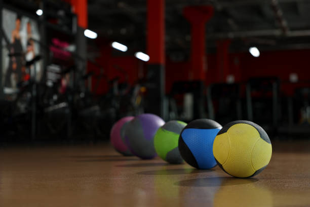 istock Medicine balls on floor in gym. Space for text 1454364345