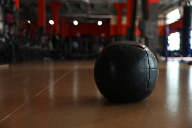 istock Medicine ball on floor in gym. Space for text 1454364842