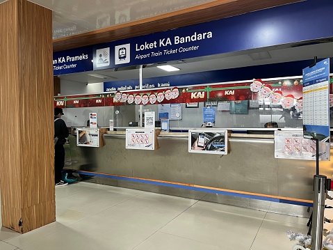 Yogyakarta, Indonesia - January 5, 2023: Ticket office in Tugu Train Station where people buying tickets.