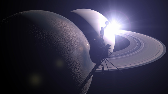 Voyager orbits Saturn and its moon Titan at dawn, passing through the rings of Saturn. / You can see the animation movie of this image from my iStock video portfolio. Video number: 1453651655