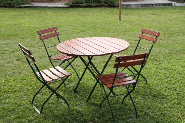 istock chairs and a round table in the garden 1454365920