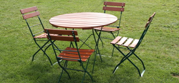istock chairs and a round table in the garden 1454365921